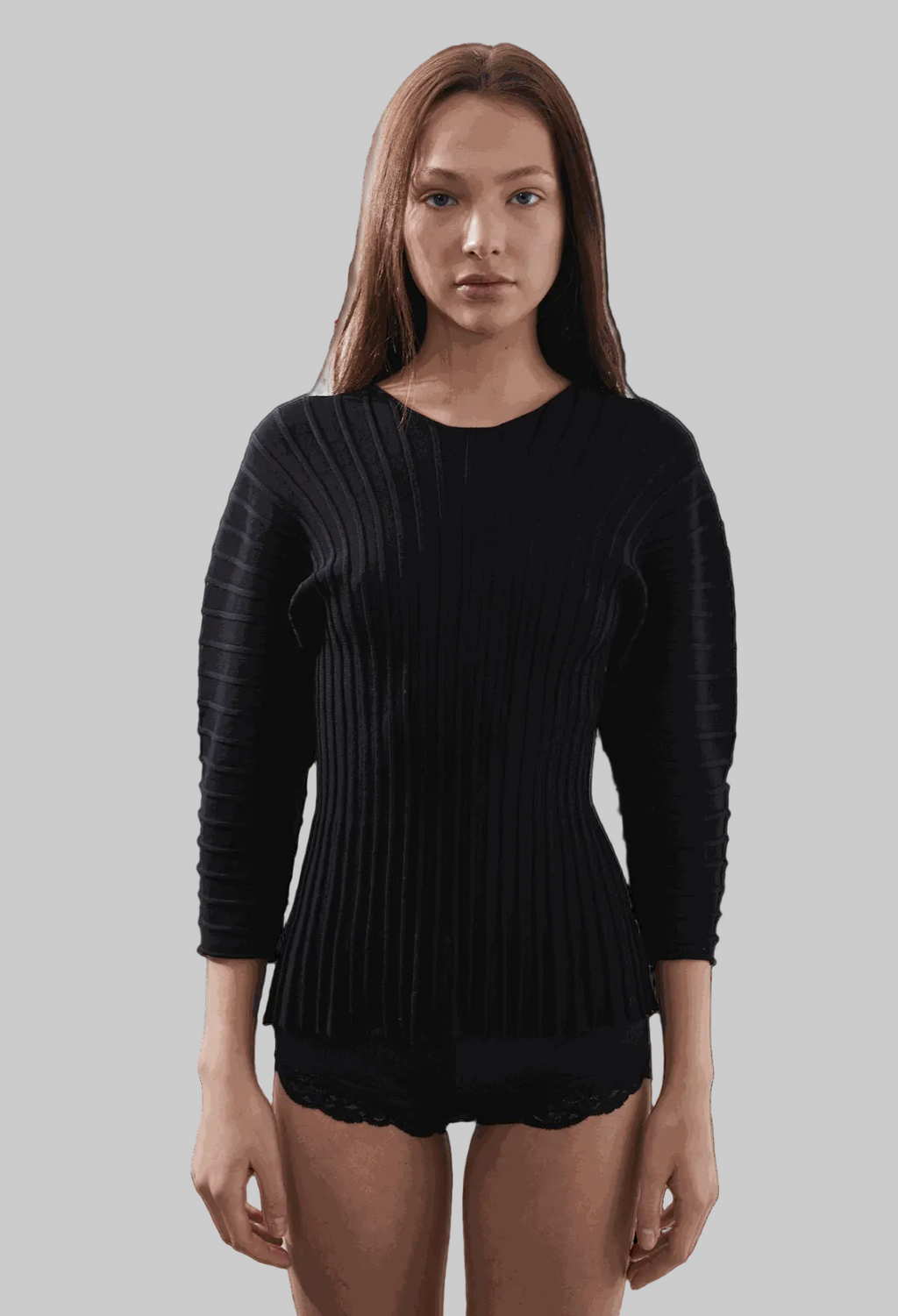 Hewal Pullover in black, featuring 3/4 dolman sleeves and fitted bodice, worn by model.