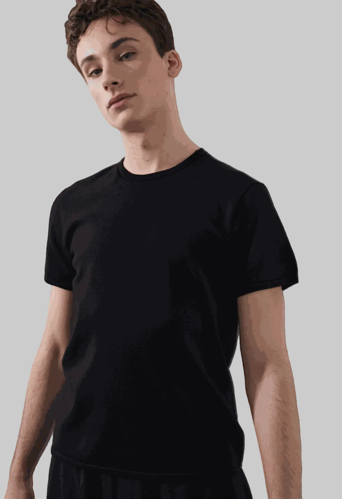 Beckett Tee in black, tailored fit, model wearing size medium.